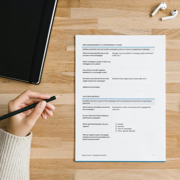 Campaign project brief template by Syntax Project Solutions showing risk management and contingency plans, and success metrics