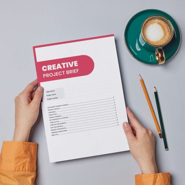 Creative project brief template cover page showing sections for client name, project details, objectives, target audience, key messages, tone, deliverables and success metrics