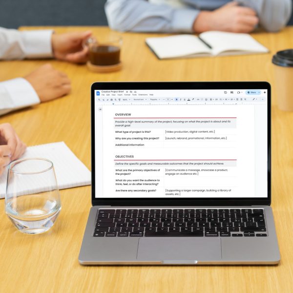 Creative project brief template for freelancers, studios and small businesses by Project Syntax Solutions shown on a laptop screen