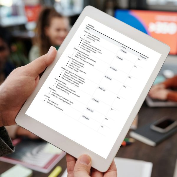 Project kick-off meeting agenda template for freelancers, studios and small businesses by Project Syntax Solutions shown on a tablet screen